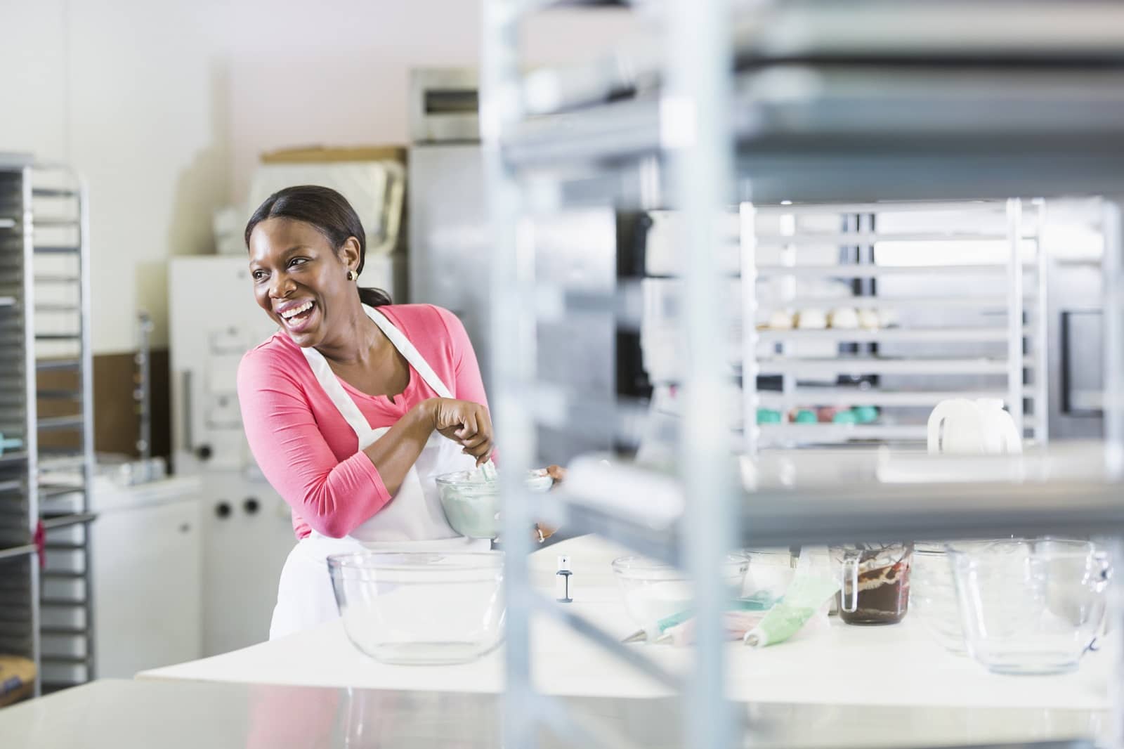 Woman working in bakery kitchen