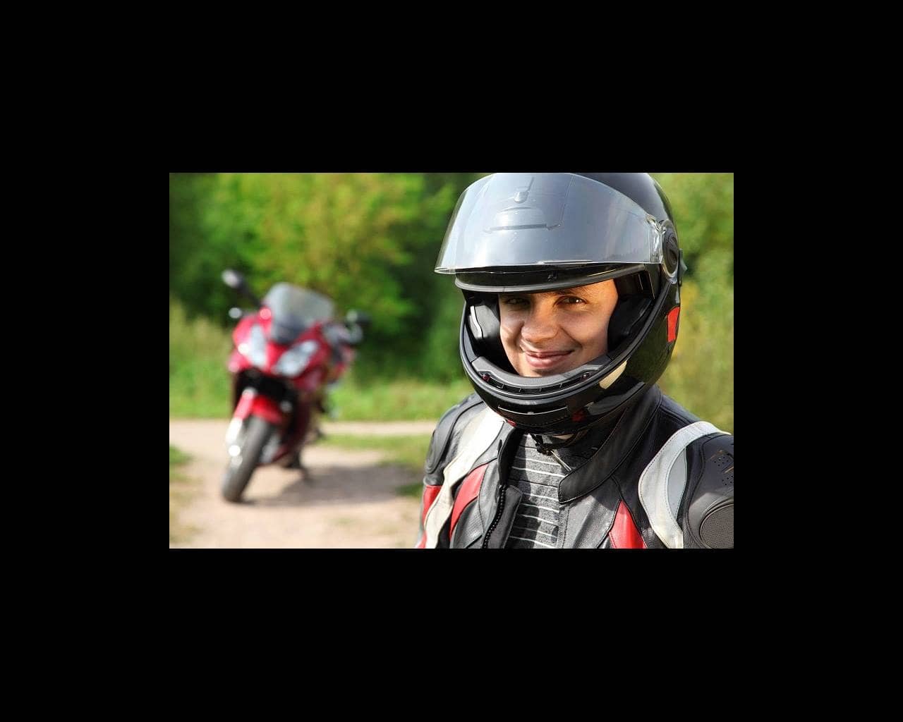 Smiling motorcyclist