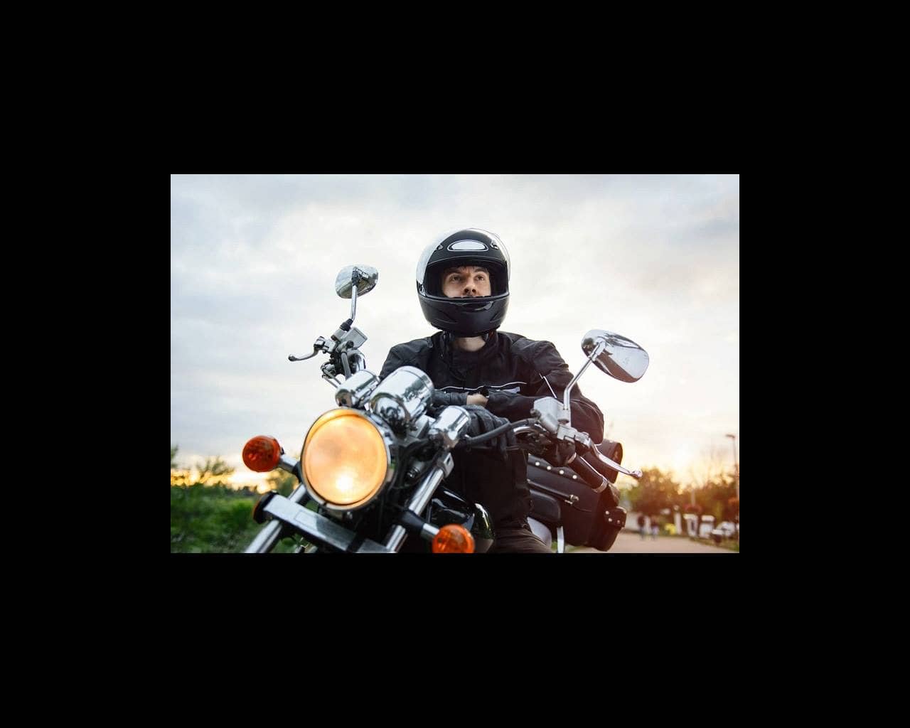 Biker wearing helmet on motorcycle