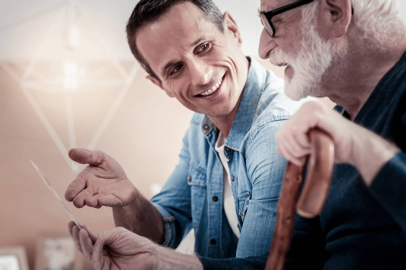father son looking at photos