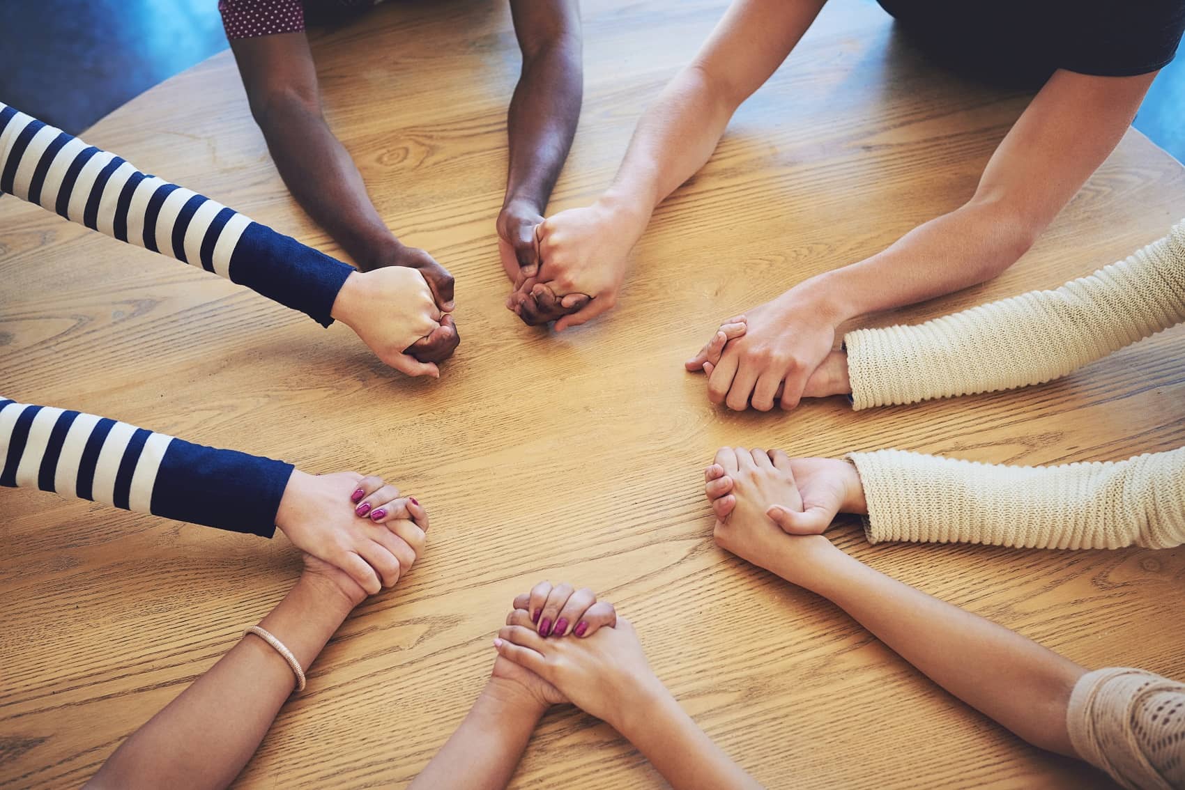 group holding hands