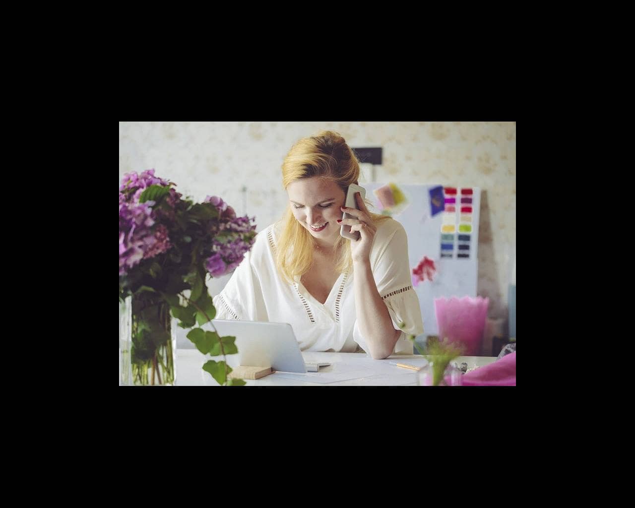 Woman on phone at desk