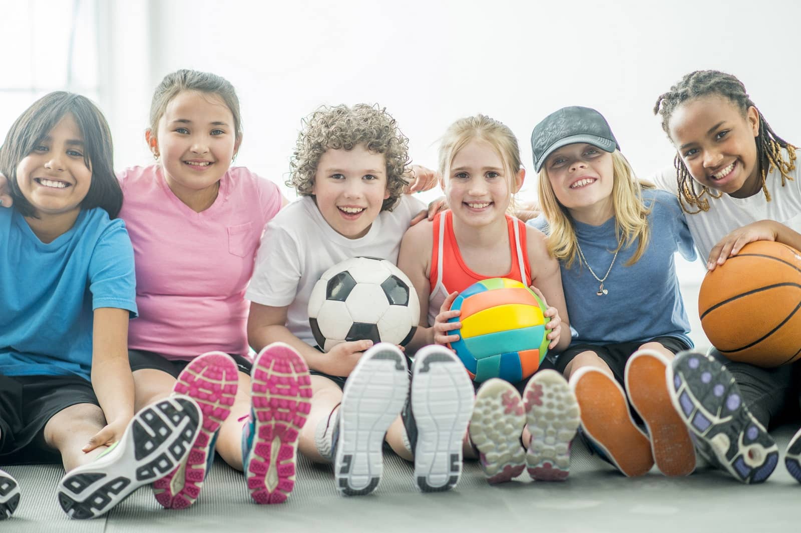 children playing with various sports