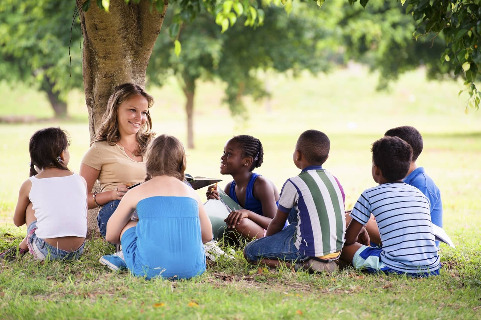 outdoor kids teacher under tree