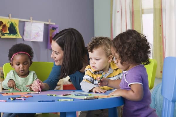 Teacher and toddlers in daycare