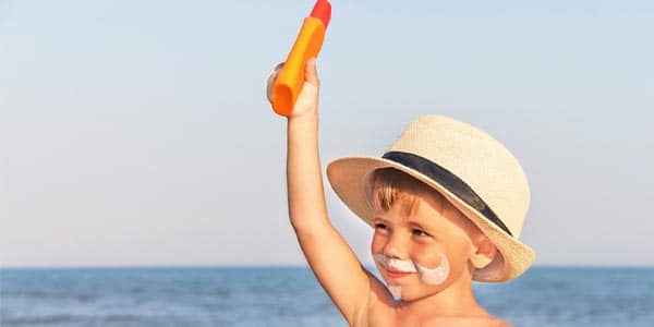 Boy with sunscreen mustache