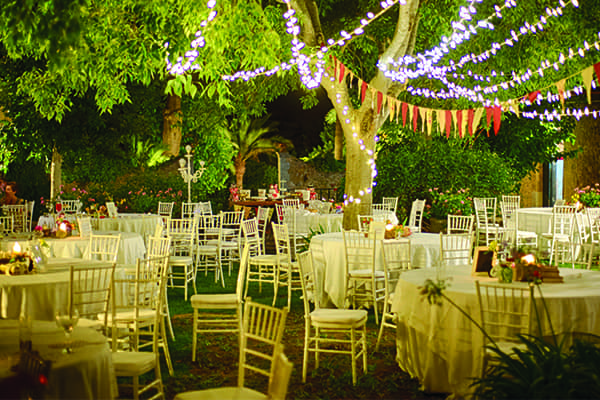 Outdoor reception with lights in trees